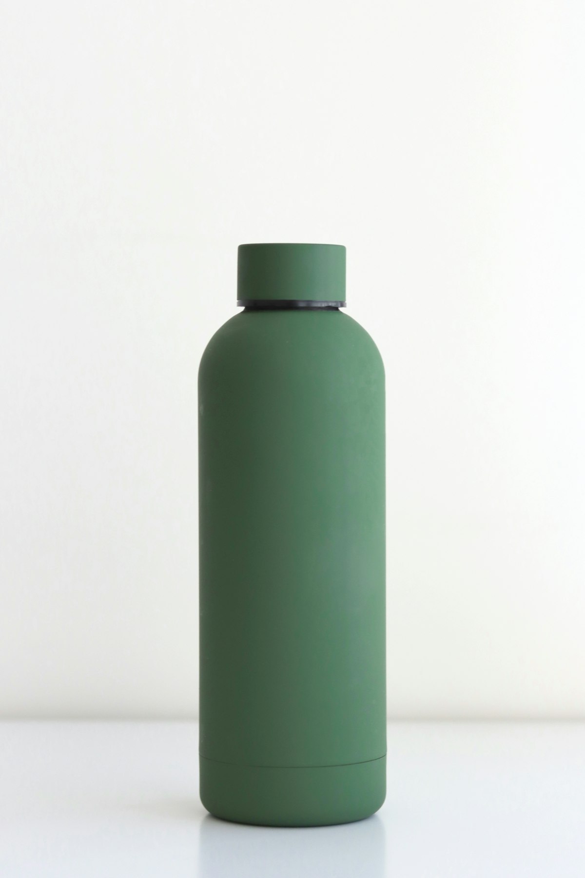 Sleek stainless steel insulated sports water bottle with digital LED hydration tracker base