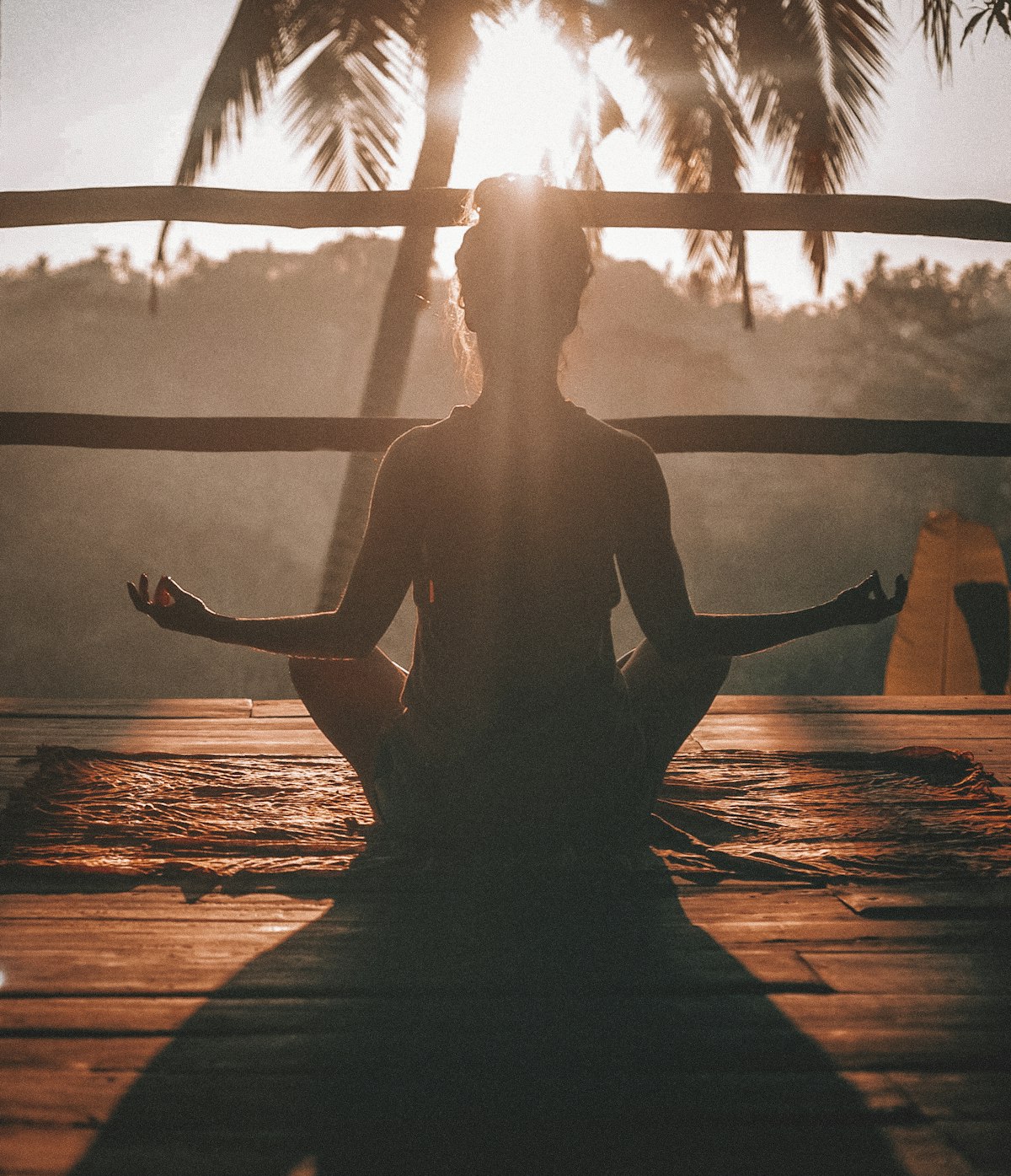 Mindfulness practitioner meditating peacefully in serene mountain sunrise nature for nervous system balance